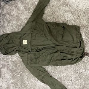 Army green button up jacket.
